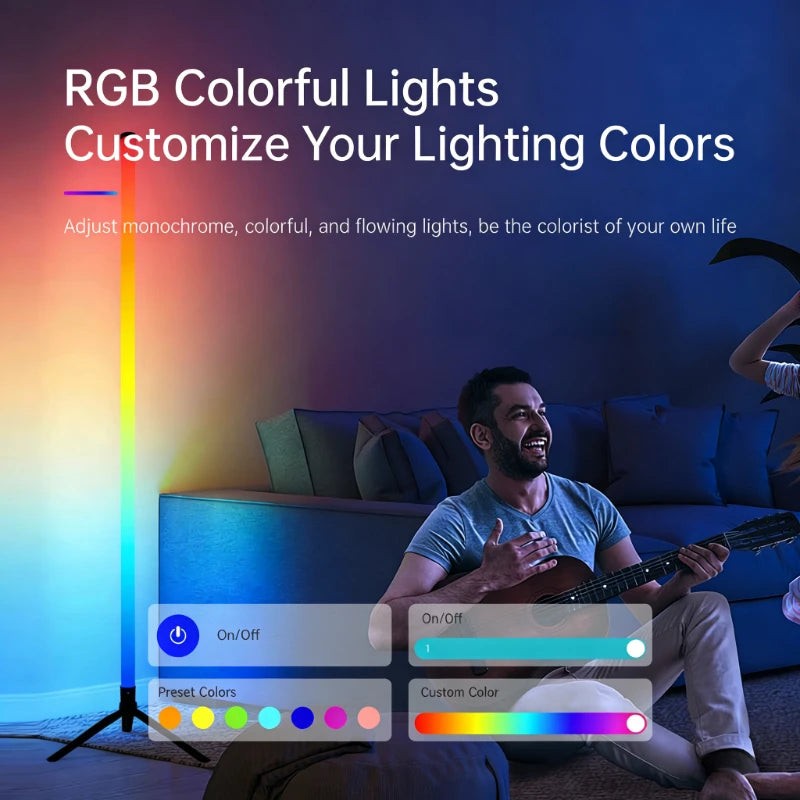 Axendris 120cm RGB LED floor lamp casting colourful ambient light in a living room with a man playing guitar